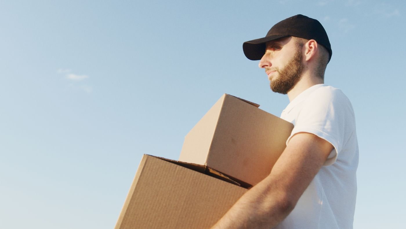 Courier delivering a package at its final destination
