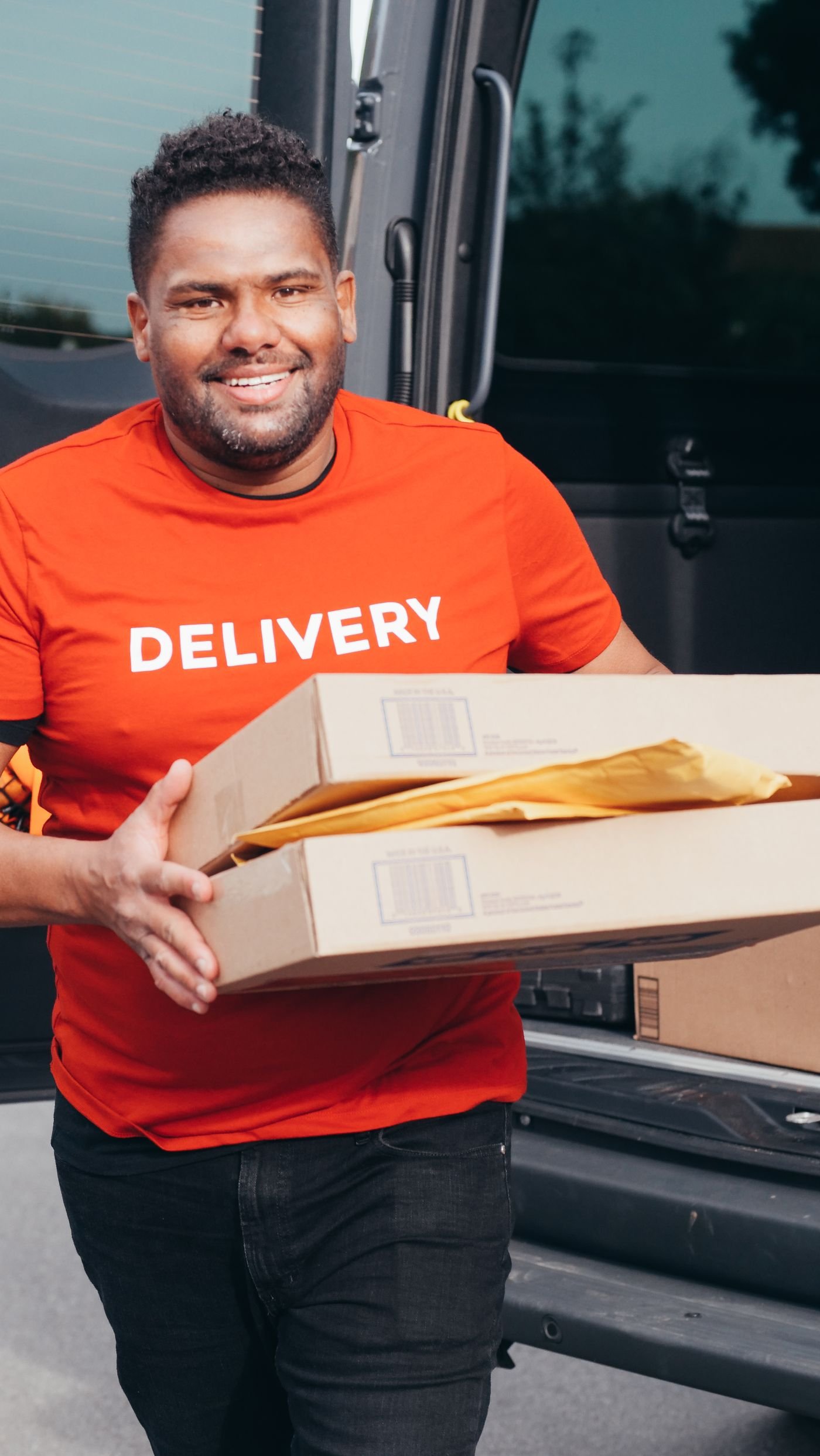 Courier preparing packages for delivery